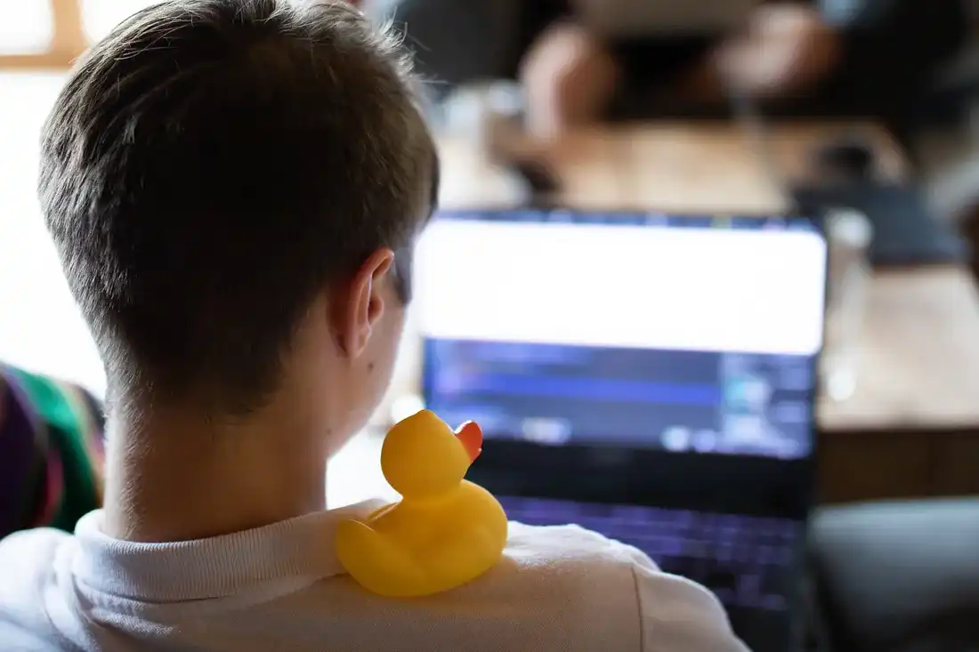 Yellow duck sitting on the shoulder